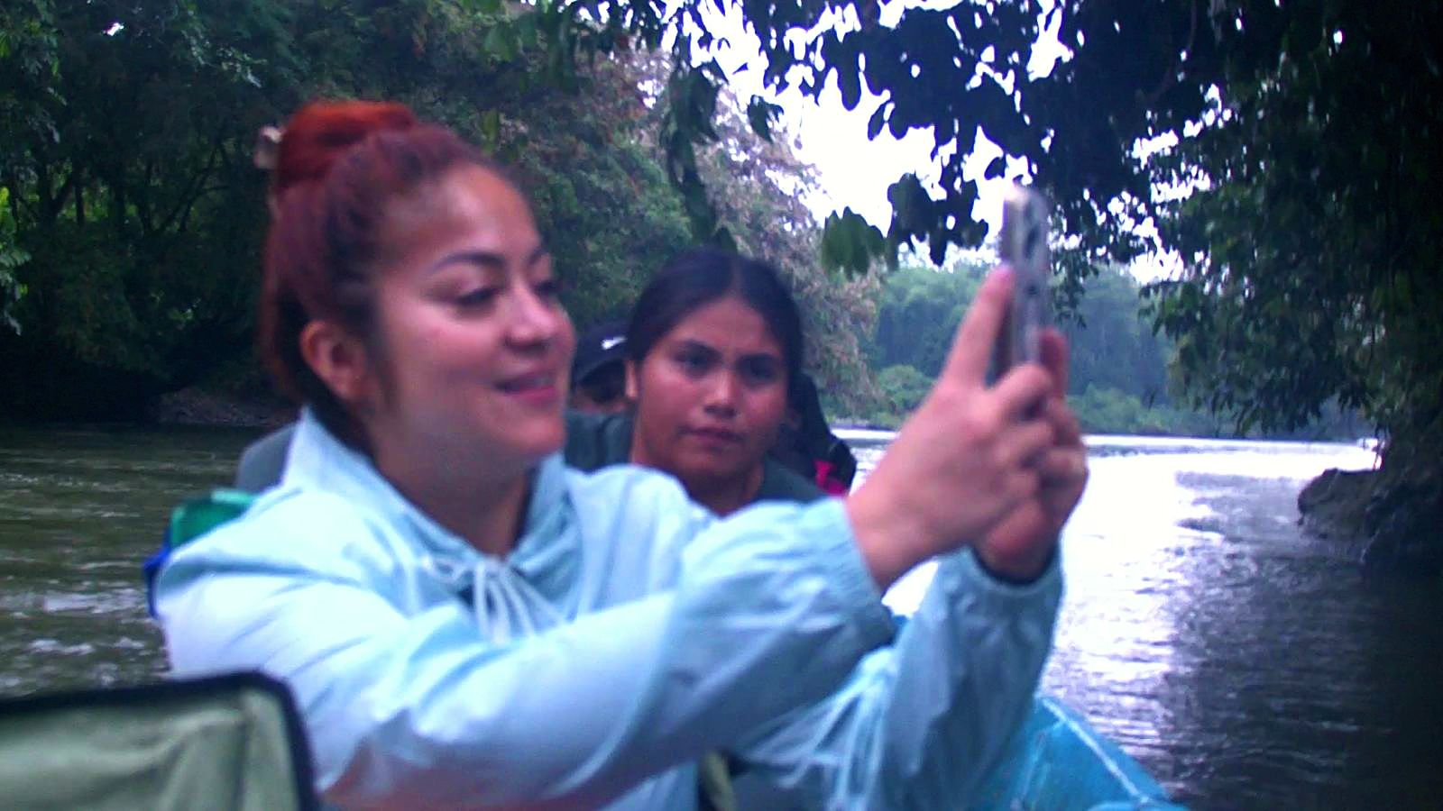 Participants taking a photo from the canoe