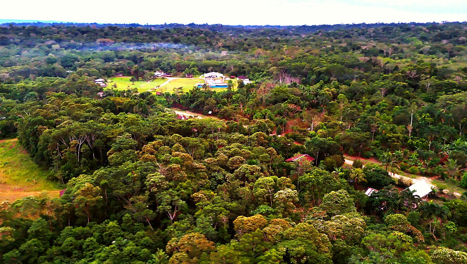 Wide aerial of Verde Sumaco surrounded by dense brush