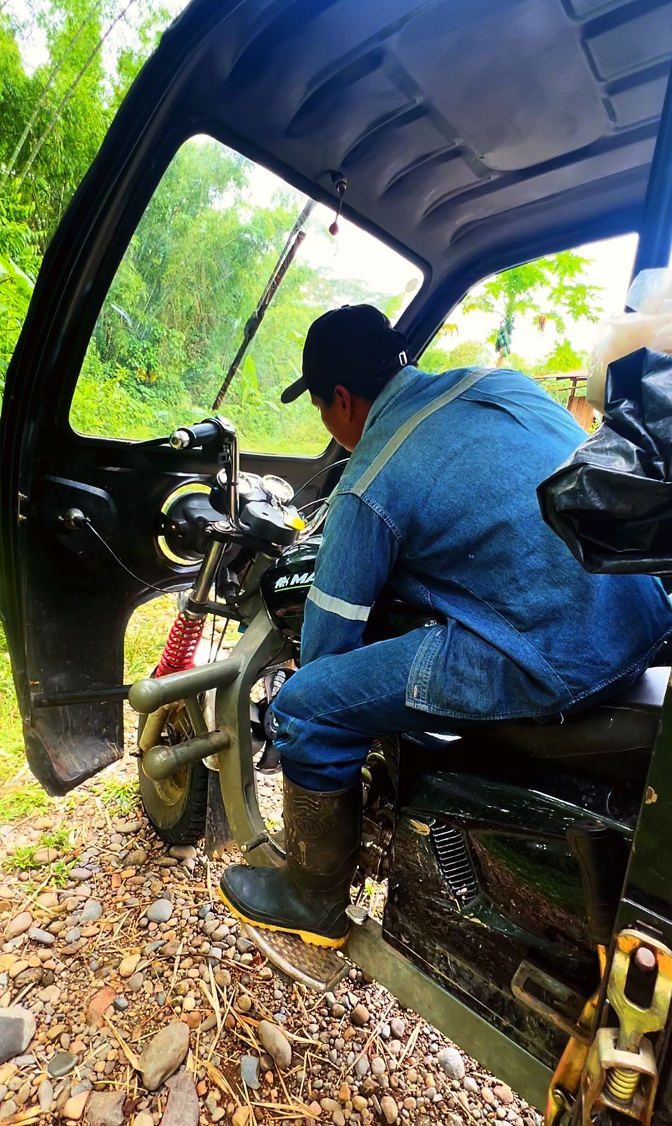 A rickshaw driver on his motorcycle cab